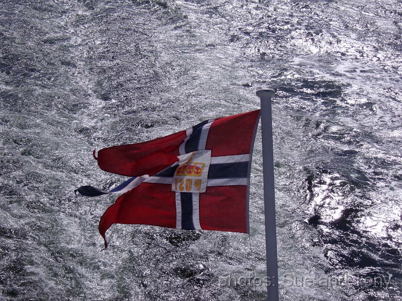 day three trondheim 0043.jpg - we just liked the sight of the flag against the sea. The boat has left Trondheim now on its way to our next stop - Rorvik